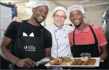  ?? PICTURE: NQOBILE MBONAMBI ?? Rugby outfit Cell C Sharks head chef Marie-Louise Keigser puts Mondli Nsele and Qiniso Khuzwayo through their paces. Both are from the Phinda Game Reserve ‘Star in Training’ three-month upskilling programme.