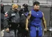  ?? JOEL MARTINEZ — THE ASSOCIATED PRESS ?? Edinburg’s Emmanuel Duron is escorted out of the stadium by police after charging a referee during a zone play-in game against Pharr-San Juan-Alamo on Dec. 3 in Edinburg, Texas.