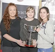  ??  ?? Three friends of Lisa Niland proudly holding the trophy in her honour; Kate Donoghue, Mary Fleming and Clodagh Murphy at the event in St Attracta’s.