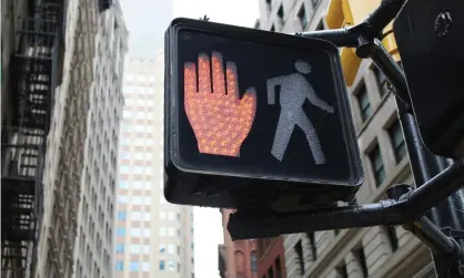  ?? Photograph: David Jackson/Getty Images/iStockphot­o ?? Ninety per cent of illegal-walking tickets issued in New York in 2019 went to black and hispanic people.