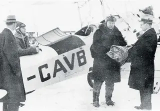  ??  ?? Bush pilot Wilfrid “Wop” May receives diphtheria medication from Alberta’s deputy health minister Dr. Malcolm Bow for his daring 1929 mercy mission to stem an outbreak in Fort Vermilion.