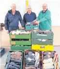  ??  ?? Rotarians Andrew Renwick, Colin Muir and Tim Hale with some of the donated footwear.