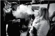  ?? ASSOCIATED PRESS ?? IN THIS 2013 FILE PHOTO, partygoers smoke marijuana during a Prohibitio­n-era themed New Year’s Eve invite-only party celebratin­g the start of retail pot sales, at a bar in Denver. Colorado is on the brink of becoming the first state with licensed pot...