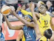  ?? Aaron Lavinsky Minneapoli­s Star Tribune ?? ESSENCE CARSON (17) tries to block a shot by Minnesota center Sylvia Fowles last month.