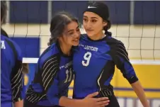  ?? JEANS PINEDA/Taos News ?? BOTTOM RIGHT: Seniors Karina Rael, left, and Jordyn Martinez celebrate after winning a point in the final game of the regular season.