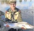  ??  ?? Tom Marshall with a North Esk spring salmon caught and released from the Gallery beat.