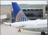  ?? ?? Company logo adorns the tail of a United Airlines jetliner being prepared for departure at Eppley Airfield on Oct. 6, 2021, in Omaha, Nebraska. (AP)