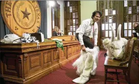  ?? JAY JANNER / AMERICAN-STATESMAN ?? Raj Mankad, of Bag Free Bayous Houston, gets dressed as a goat for a news conference Tuesday at the Capitol to show his support for plastic bag bans. Austin and a dozen or more Texas cities limit the use of plastic bags.