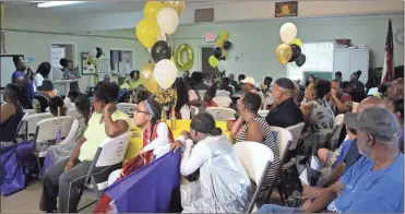  ?? / Kevin Myrick ?? Local youth and members and friends of the Youth Summerfest organizing committee gathered for a pre-celebratio­n at the Turner Street Center in Cedartown on Friday, July 27. The committee celebrated 20 years of the program helping local youth with...