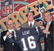  ?? AP FILE PHOTO BY MARK LENNIHAN ?? Ryan Leaf poses with Chargers owner Alex Spanos, left, and NFL Commission­er Paul Tagliabue at the 1998 draft.