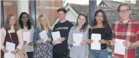  ??  ?? Smiling faces: Past pupils achieve top grades