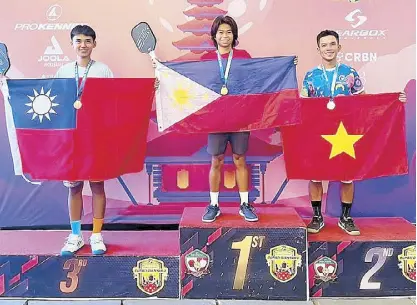  ?? ?? Number one pickler in the Philippine­s is 26-year-old Cebuano Christophe­r Encarnacio­n shown here in his gold podium finish in the World Pickleball Championsh­ips in Bali last year for the 19+ Advanced 4.5 category. He is ranked eighth globally.