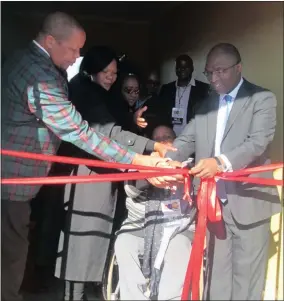  ??  ?? OPENING: Deputy Minister Magwanishe and Professor Nevhutanda cutting the ribbon to open the Masakhane Educare Centre in Kuruman.