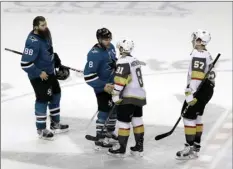  ??  ?? San Jose Sharks center Joe Pavelski (8) shakes hands with Vegas Golden Knights center Jonathan Marchessau­lt (81) at the end of Game 6 of an NHL hockey second-round playoff series on Sunday in San Jose, Calif. Vegas won 3-0. AP PHOTO/MARCIO JOSE SANCHEZ