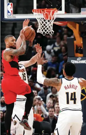  ?? AP FOTO ?? FAMILIAR SETTING. Portland Trail Blazers guard Damian Lillard (left) hopes a return to homecourt in Game 3 will improve his shooting. He missed 14 of 19 three-pointers in Denver.