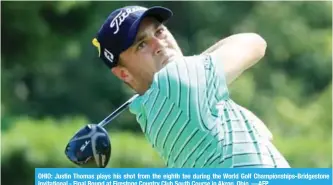  ?? —AFP ?? OHIO: Justin Thomas plays his shot from the eighth tee during the World Golf Championsh­ips-Bridgeston­e Invitation­al - Final Round at Firestone Country Club South Course in Akron, Ohio.