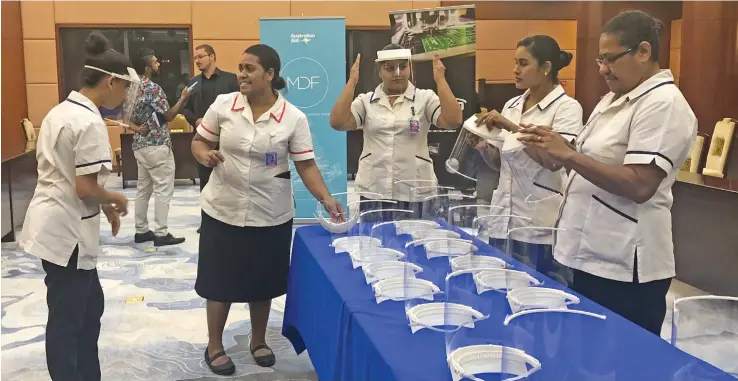  ?? Photo: Inoke Rabonu ?? Health workers trying on the 3D face shields at the Civic Centre on May 27, 2020.