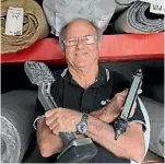  ??  ?? Armed with staple gun and stretcher Matamata’s long serving carpet layer Bob Hughes is ready to hit the floor