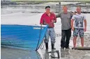  ??  ?? Locals John Martin, Tommy Shaw and holiday maker Dougie launch community boat ‘Saorsa’: Gaelic for freedom.