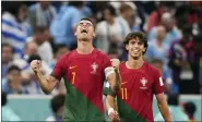  ?? MARTIN MEISSNER — THE ASSOCIATED PRESS ?? Portugal’s Cristiano Ronaldo, left, celebrates in front of teammate Joao Felix after the opening goal against Uruguay during a World Cup Group H match at the Lusail Stadium in Lusail, Qatar, on Monday.