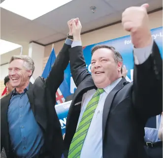  ?? GAVIN YOUNG ?? Jason Kenney celebrates with past MLA Dave Rodney after winning the Calgary-Lougheed byelection last week. Landslide is an apt middle name for Kenny, writes Licia Corbella.