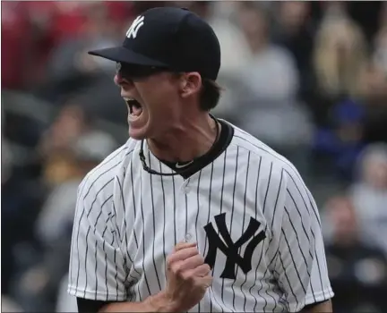  ?? JULIE JACOBSON — THE ASSOCIATED PRESS ?? New York Yankees pitcher Tyler Clippard reacts after striking out St. Louis Cardinals left fielder Randal Grichuk with two men on base to end the baseball game, Saturday in New York. The Yankees won 3-2.