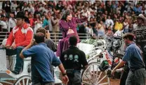  ?? Express-News file photo ?? Jennifer Lopez, portraying Selena, gives the crowd at the Alamodome a thumbs up during the filming of the 1997 biopic.