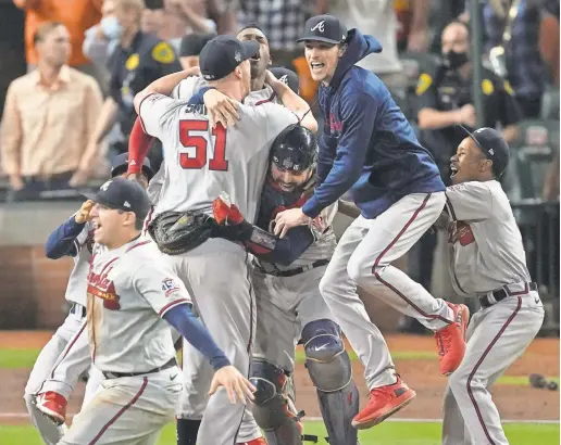  ?? SUE OGROCKI/AP ?? Braves players celebrate the last out in World Series Game 6 at Minute Maid Park in Houston.