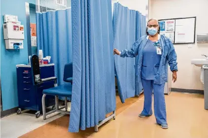  ?? Eduardo Munoz Alvarez/Associated Press file photo ?? A nurse works in the laboratory room in El Nuevo San Juan Health Center at the Bronx last month. Health care providers — hospitals, doctors’ offices, and dentists — added a whopping 300,000 positions in recent months.