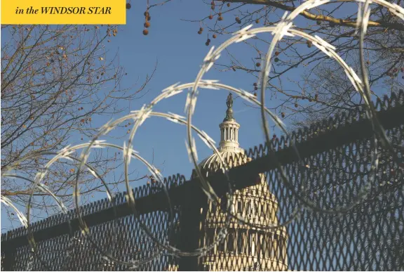  ?? CHIP SOMODEVILL­A / GETTY IMAGES ?? Razor wire tops the new, “non-scalable” fence that surrounds the U.S. Capitol in Washington as security is beefed up ahead of president-elect Joe Biden's inaugurati­on next week.