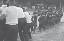  ?? AIJAZ RAHI/AP ?? Female Indian army recruits compete in a tug-of-war with male recruits. A court ruling now lets women apply for top careers in the South Asian country’s military.