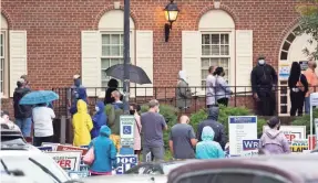  ?? L. TODD SPENCER/THE VIRGINIAN-PILOT VIA AP ?? Voters line up in Virginia Beach, Va., for early voting Sept. 18.