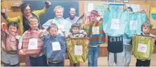  ?? PHOTO: SUPPLIED. ?? Boomerang Bags’ Lisa Eagle and Christine McCluskey, back row, donated a reusable bag to each member of the Waipukurau Cubs on their recent visit.