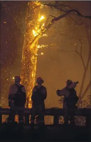  ??  ?? Firefighte­rs battle the Glass Fire as it flares up along Highway 29 south of Robert Louis Stevenson State Park in Calistoga on Thursday.