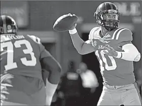  ?? AP file photo ?? Jordan Ta’amu returns at quarterbac­k after a strong finish to the 2017 season after replacing Shea Patterson, who went down with a knee injury. Ta’amu passed for 1,682 yards while completing 66.5 percent of his passes, and throwing for 11 touchdowns and 4 intercepti­ons.