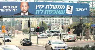  ?? צילום: אי.אף.פי ?? בכוונת של בנט: מעוזי הליכוד. שלט של ימינה בירושלים