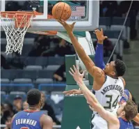  ?? TOM LYNN, ASSOCIATED PRESS ?? Giannis Antetokoun­mpo goes up for a shot over the Detroit defense Friday night.