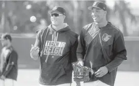  ?? KARL MERTON FERRON/BALTIMORE SUN ?? Third baseman Manny Machado, left, with Jonathan Schoop, extended condolence­s to the Royals and the family of late pitcher Yordano Ventura, who died over the winter.