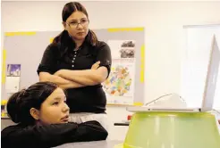  ??  ?? Sisters Kay and Flo Laboucan watch a video at the Health Centre in Cadotte Lake. Flo has gone back to school “so my kids can have a better life.”