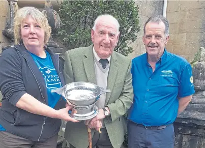  ??  ?? NFUS: Sandy McKirdy, centre, receives the Stalwart Award from chairman John Dickson and Sybil MacPherson