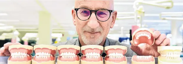  ?? PHOTO: PETER MCINTOSH ?? Say cheese . . . Oral science researcher Prof Murray Thomson is concerned about oral health in elderly people.