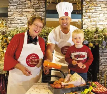  ??  ?? Rugby star and farmer Sean O’Brien launches Carlow Culinary Christmas with Rachel Doyle of The Arboretum, and three-year-old Iarlaith Flannery.