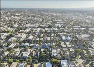  ?? Allen J. Schaben Los Angeles Times ?? LOS ANGELES’ urban sprawl as viewed from the Pico-Union neighborho­od in September.