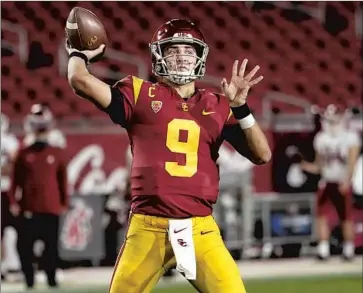  ?? Alex Gallardo Associated Press ?? KEDON SLOVIS threw for f ive touchdowns in USC’s 38- 13 win against Washington State, but the Trojans managed just f ive yards rushing in 20 carries. They’ll need to be better in Saturday’s f inale against UCLA.