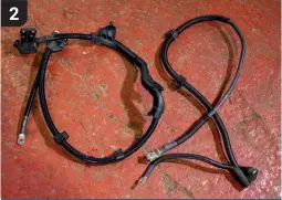  ??  ?? The problem stems from the alternator/starter cable being routed in such a way it is exposed to repeated heat cycles in the engine bay, causing deteriorat­ion. A new genuine cable (pictured left) costs less than £90 and the fix should take you no more than three hours, though allow extra time if working with a Tiptronic-equipped 997 (due to more compact packaging). 2