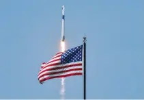  ??  ?? AN AMERICAN FLAG is seen as SpaceX Falcon 9 rocket and Crew Dragon spacecraft lifts off during NASA’s SpaceX Demo-2 mission to the Internatio­nal Space Station from NASA’s Kennedy Space Center in Cape Canaveral, Florida, May 30.