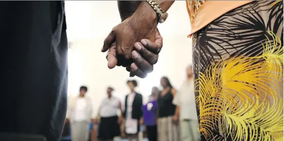  ?? GETTY IMAGES ?? Worshipper­s pray at a service for Aretha Franklin at the New Temple Missionary Baptist Church days after her death. Franklin recorded her bestsellin­g album there in 1972.