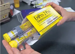  ?? RICH PEDRONCELL­I, AP ?? The price insurers and employers pay for the EpiPen, which treats severe allergic reactions, has increased about 150% since 2009.