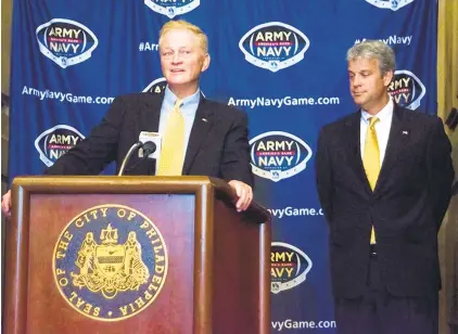  ?? AP ?? Boo Corrigan, right, and Chet Gladchuk, pictured in August 2017. Corrigan, who is North Carolina State’s athletic director, has been appointed the College Football Playoff selection committee chair while Gladchuk, the longtime Naval Academy athletic director, has been named to the selection committee.