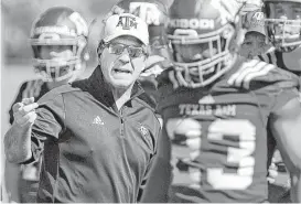  ?? Dave McDermand / Associated Press ?? Texas A&M coach Jimbo Fisher talks to players during the first day of spring practice Tuesday. The spring game is Saturday at Kyle Field.